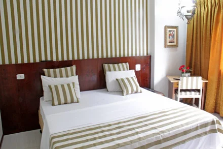 Cama de casal da Suíte Luxo